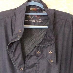 Greg Norman Navy, full zipper, snap windbreaker. 2 pockets. NWOT.‎